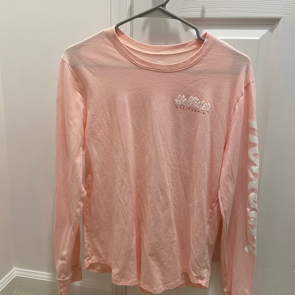 peach/pink long sleeve shirt